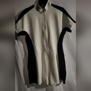 NWT Bad Birdie golf romper. Color block black/cream/purple on collar. Size Large